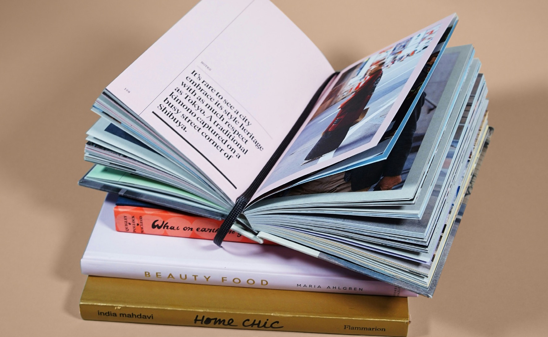 An open book on a stack of books